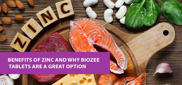 Zinc-rich foods like salmon, beef, cheese, beans, and spinach on wooden board, Phlox wellness