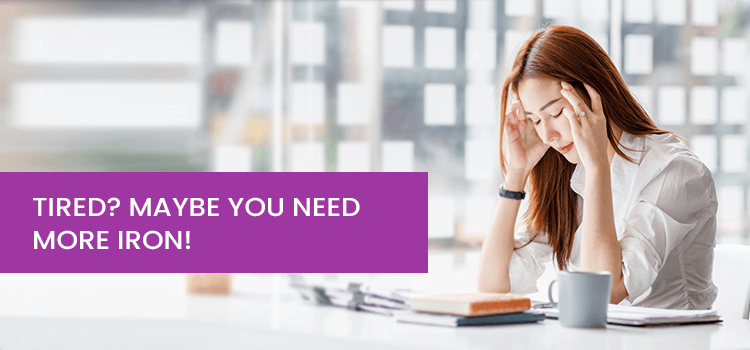 Woman looking tired at desk with text 'Tired? Maybe you need more iron!' promoting Phlox wellness