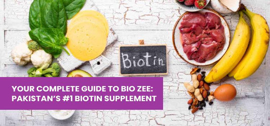 Biotin-rich foods including eggs, bananas, nuts, leafy greens, meat, and cheese on a rustic table.